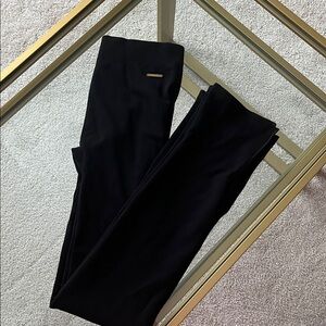 Fabletics Black Woven Leggings with Gold Logo and Split Flair Bottom Detail- Med